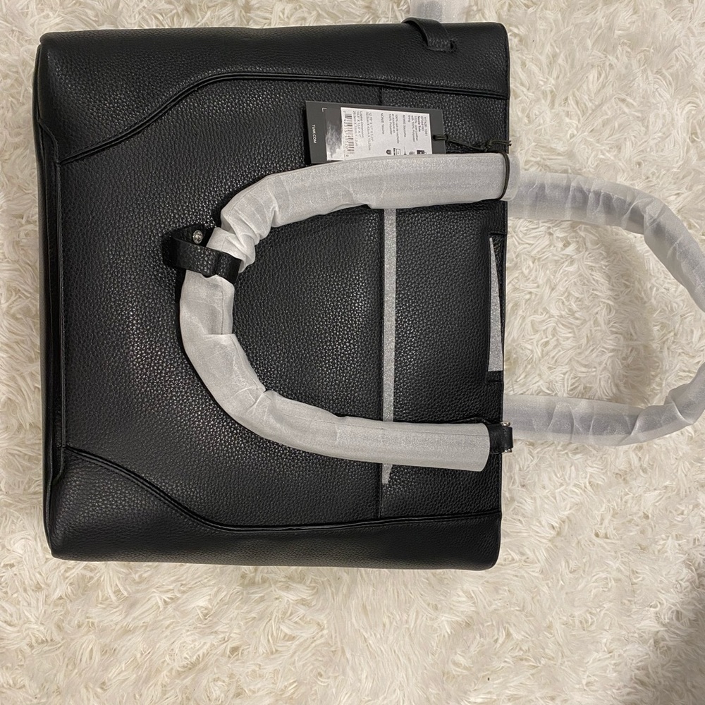 Tumi bag. Brand new with tags and box. Black, NEW